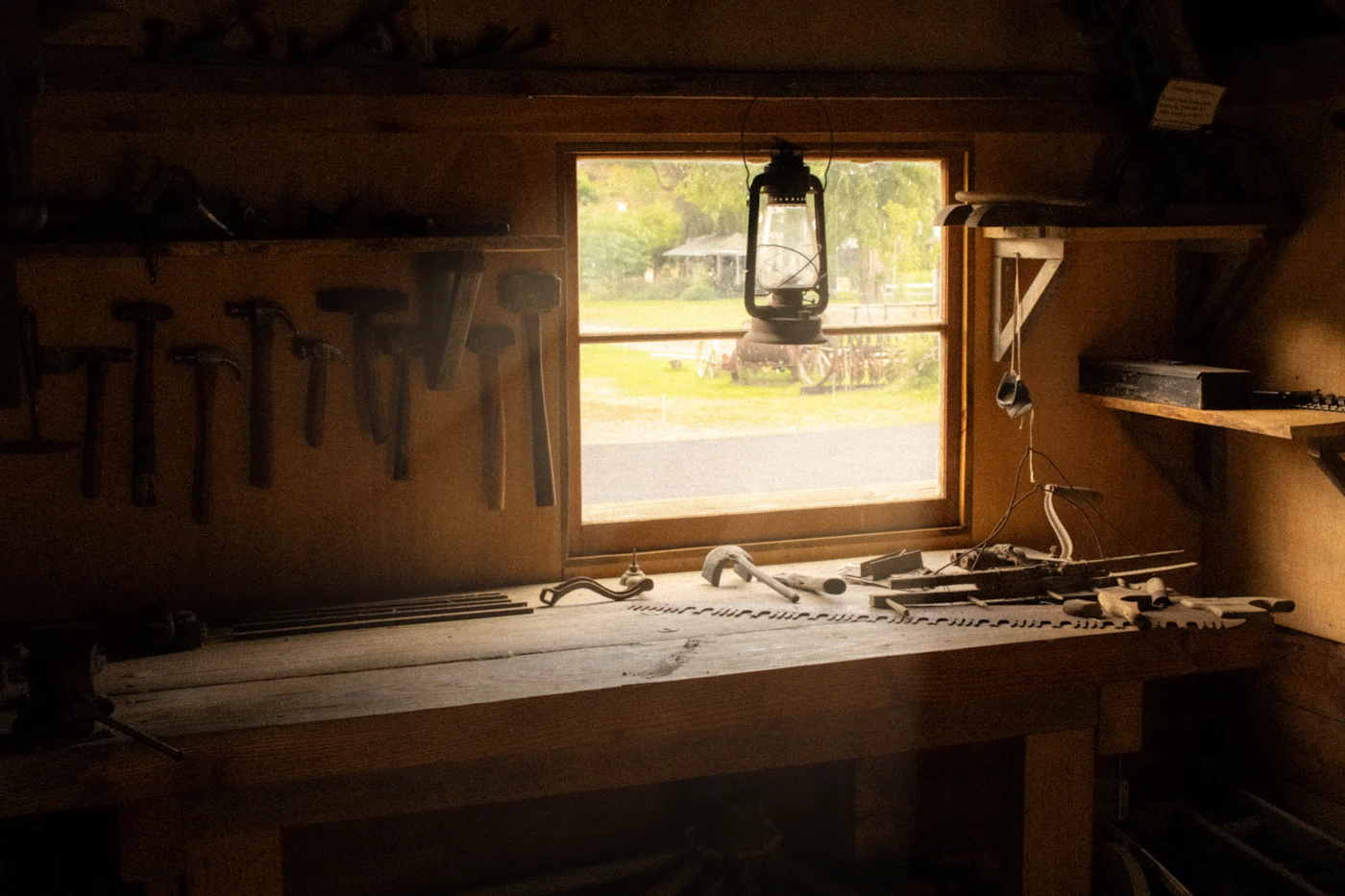 The warm interior of Jingles McSprocket's workshop, full of half-finished toys, paint pots, and twinkling lights